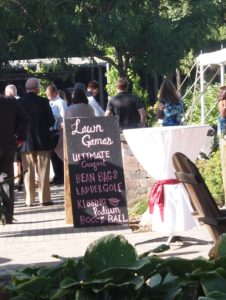 Jessica & Carson at The Gardens Of Castle Rock ~ Minnesota Outdoor Wedding - Lawn Games Sign